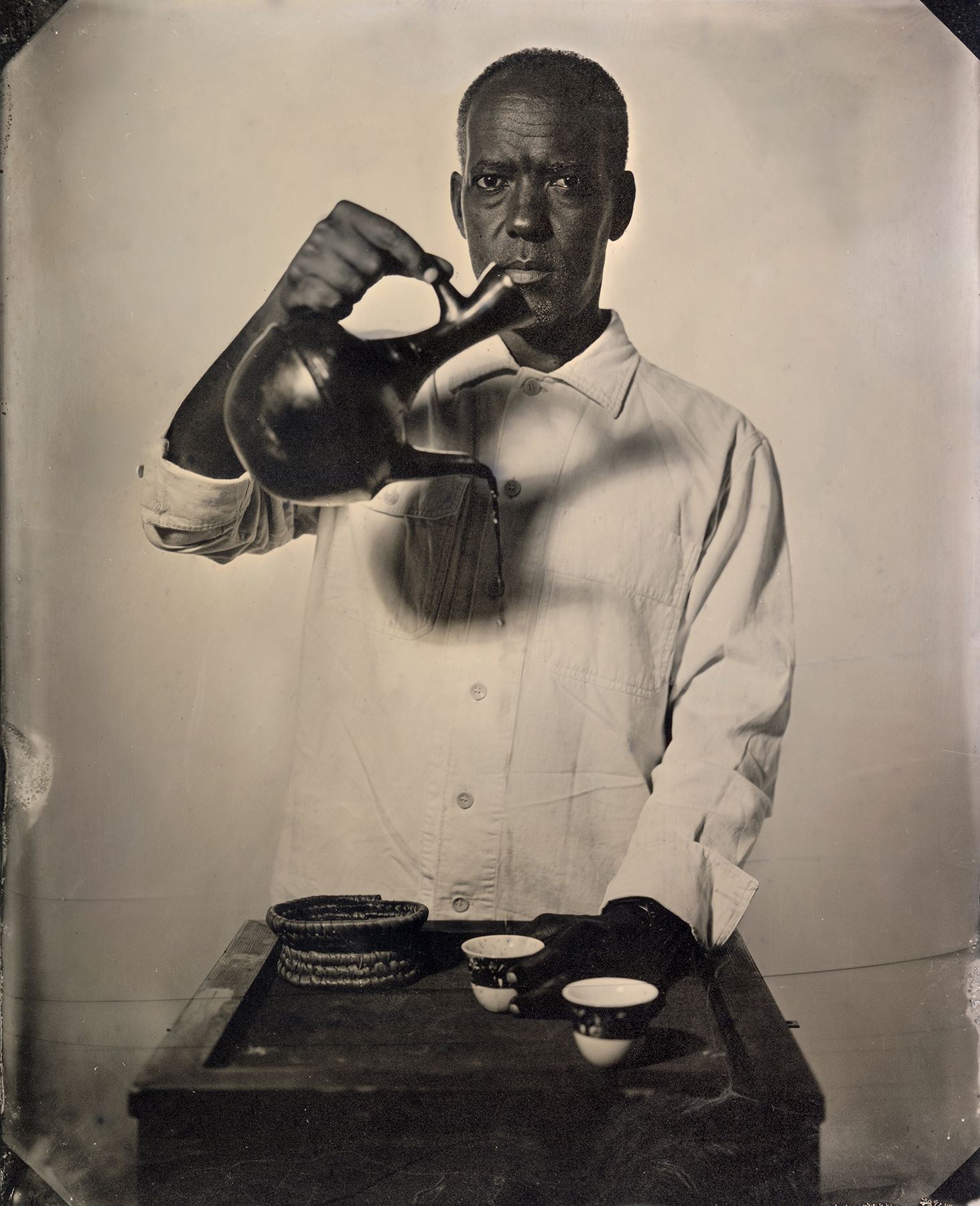 Eyakem Gulilat pouring coffee from a jebena